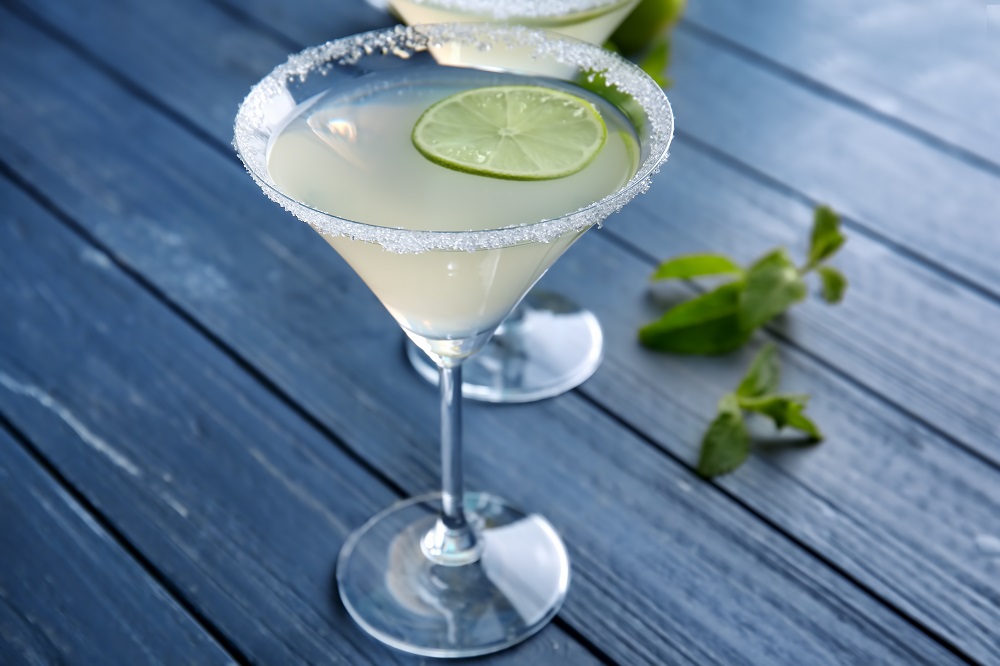 Sterling's Harper House Snow Queen: Empress 1908 gin, rosemary simple syrup and lime jiuce in a martini glass with a sugar rim. Photo by Africa Studio, lic. Adobe Stock # 173682162