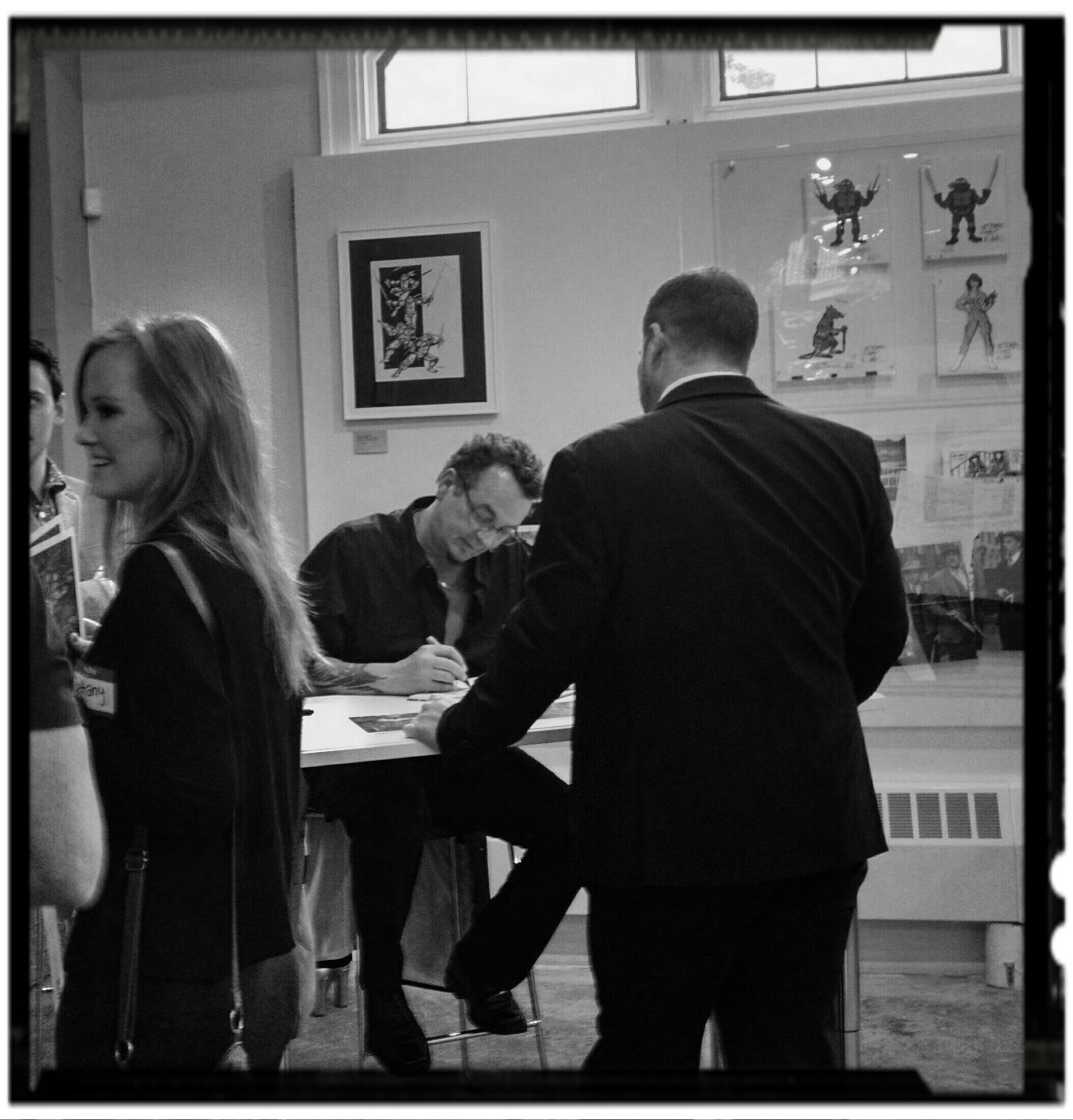 Kevin Eastman signs special edition TMNT lithos at SDCAG opening gala. Photo: JSDevore